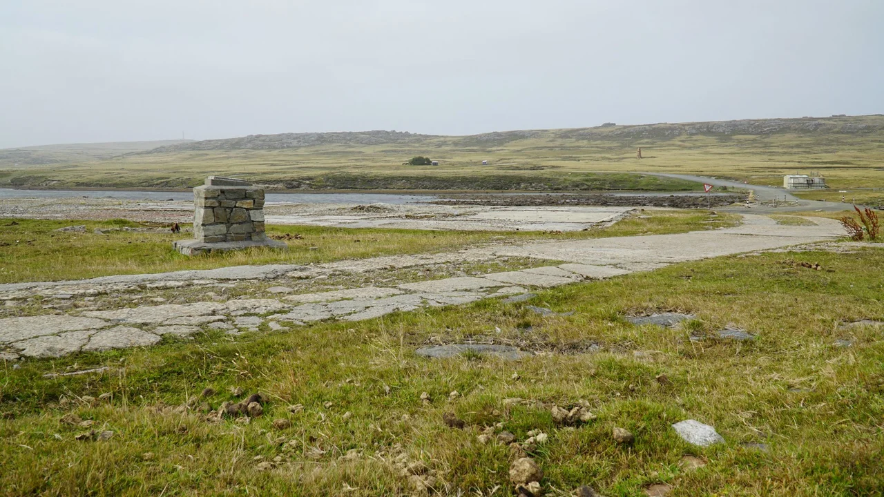 Site of Moody Brook Barracks, the island garrison for the Falklands. A small detachment of Royal Marines was stationed here from the 1960s until the invasion of 1982 when Argentine forces forcibly took the barracks and evicted the British troops. The barracks site is that of the old wireless station. Only foundations remain today.