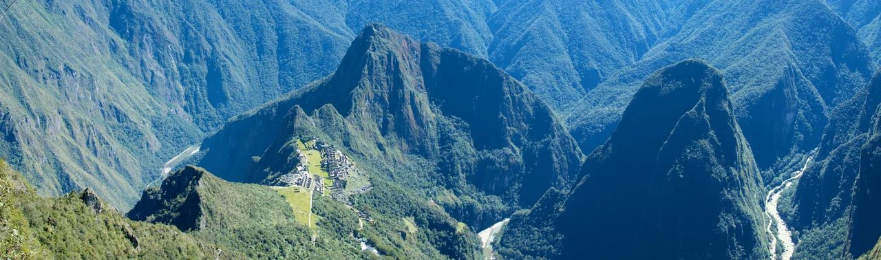 The peeks and valleys surrounding Machu Picchu  like a wreath are almost more beautiful and awing than the site itself. It is lush and rugged terrain with the Urubamba River weaving drunkenly through.

From Machu Picchu Mountain you can really get a sense of the high protected plateau Machu Picchu was built on and how remote and inaccessible the site is.  It is simply gorgeous country.