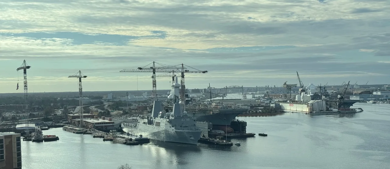 Dry docks at the National Steel and Shipbuilding Company shipyard in Norfolk, Virginia. The ships in the foreground are the USS Arlington and USS Bataan.