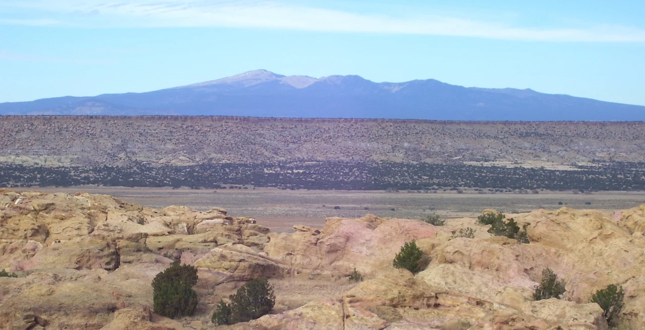 A view of Mount Taylor to the north from the west end of the Sky City of Acoma Pueblo. The mountain is sacred to the Acoma people.