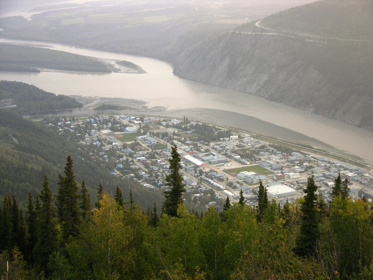 A photograph of Dawson City, Yukon from Midnight Dome. The Yukon River (right and upper) and Klondike River (left) are also shown.
Camera and Exposure Details:Camera: Nikon Coolpix 8700Lens: Nikon Zoom Nikkor ED 8.9-71.2mm 1:2.8-4.2Exposure:
18.8mm (73.9mm in 35mm equivalent) f/3.3 @ 5/128 s.