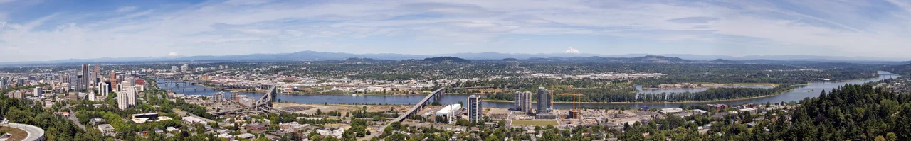 The Willamette River as it passes through downtown Portland, Oregon. This image is a stitch made from 10 photographs. The bridges, from right to left, are the Sellwood, Ross Island, Marquam, Hawthorne, Morrison, Burnside, Steel (the black bridge that is partially obscured), Fremont (the arch bridge at far left). The mountains, from right to left, are Mount Hood, Mount Adams (only the tip is visible) and Mount Saint Helens.