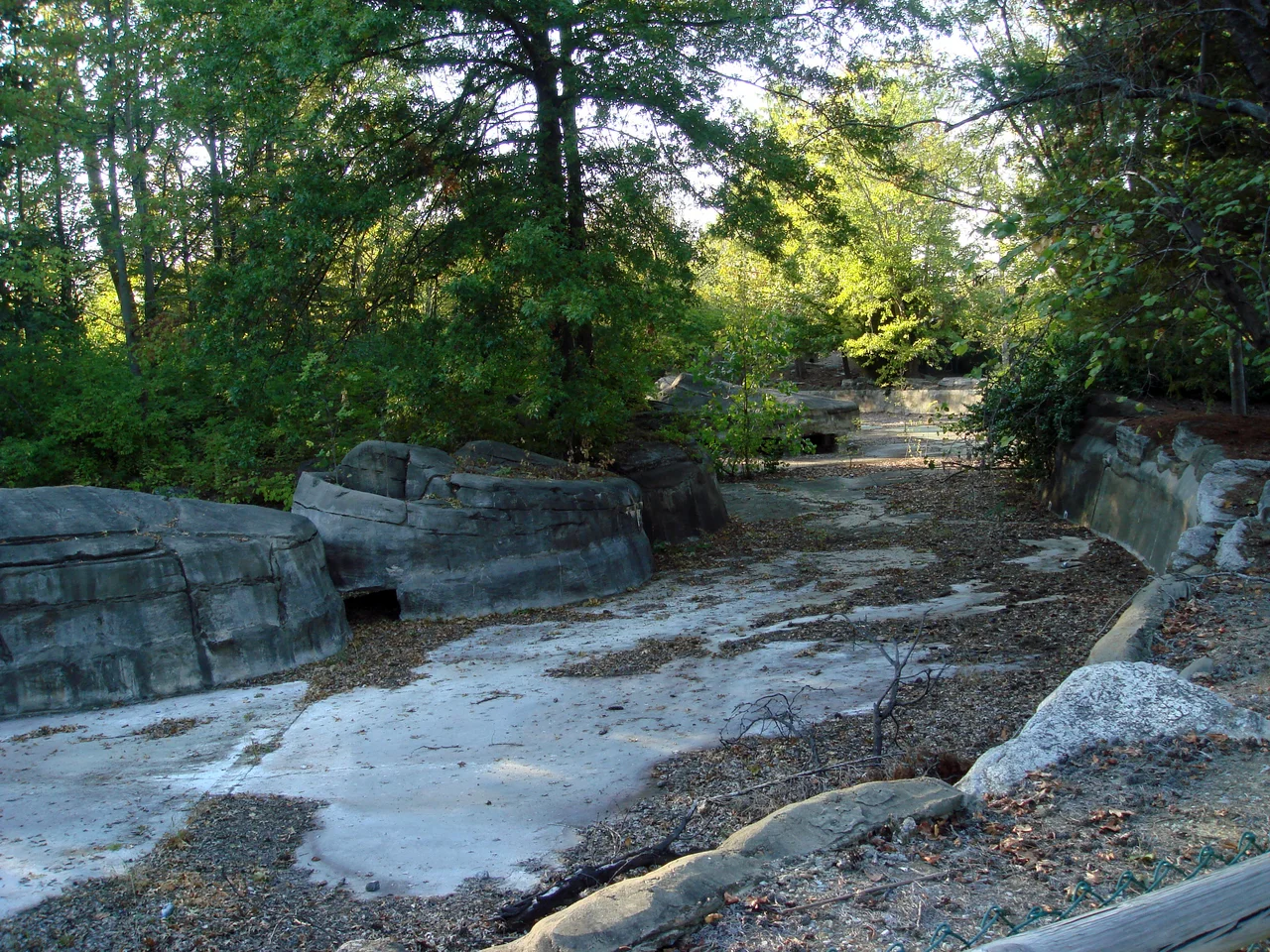 The leftover ruins of the defunct Opryland USA (in Nashville, Tennessee), which took its name from the Grand Ole Opry music venue (which was originally located in downtown Nashville but moved next door to the new theme park in the 1970s). What is now the enormous Gaylord Opryland Resort & Convention Center opened soon afterwards and began expanding into the empty land near the park, curtailing expansion. The theme park closed at the end of 1997, and was mostly demolished to make room for the Opry Mills shopping center. Only a tiny portion of the old park remains, this is a photo of the former Grizzly River Rampage. These sections will be demolished for the next Opryland hotel expansion.
