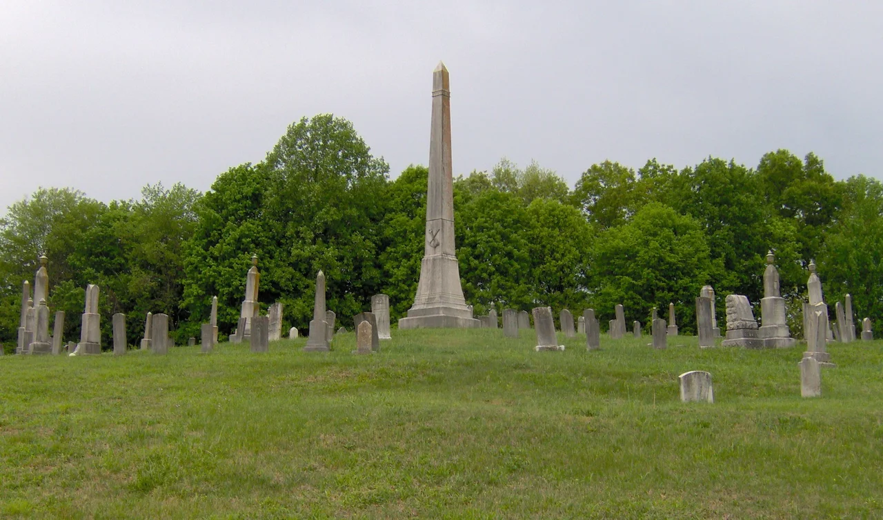The Fraterville Miners' Circle at Leach Cemetery (behind Clear Branch Baptist Church) in Lake City, in the U.S. state of Tennessee. The circle contains the graves of 89 miners killed in the Fraterville Mine Disaster, which occurred opposite Walden Ridge in the community of Fraterville, on May 19, 1902. The explosion killed 216 miners, 184 of whom were identified. The names of these 184 miners are listed on the obelisk at the center of the circle. The circle was added to the U.S. National Register of Historic Places in 2005.