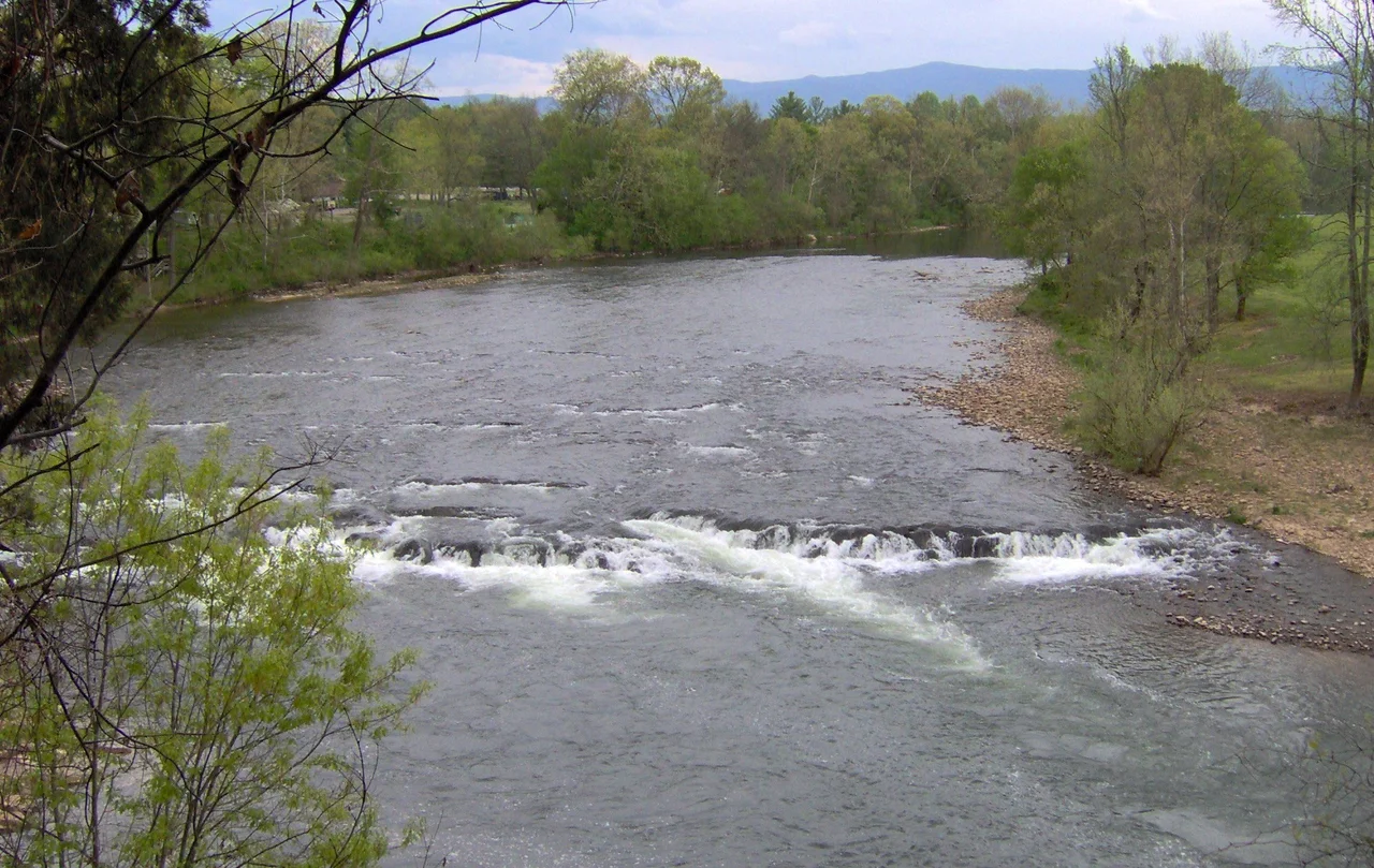Shoals along the Nolichucky River at Davy Crockett Birthplace State Park in Greene County, Tennessee, in the southeastern United States. Crockett recalled his brothers nearly drowning trying to paddle a canoe over a "fall" in the Nolichucky near their home. The view is from a trail that follows the river bluffs.