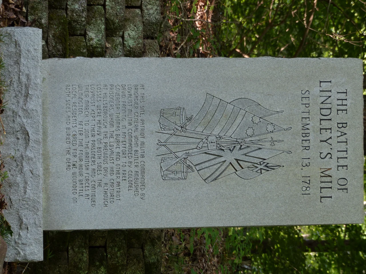 Taken at 35° 53.343′ N, 79° 20.596′ W. An image of one of three memorial stones for the Battle of Lindley's Mill.