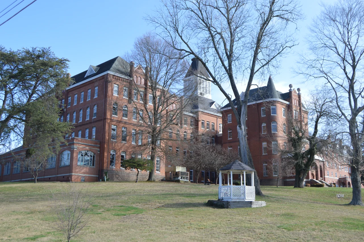 Southern front and western side of buildings (at center, the Main Building, constructed 1890) on the campus of the former Virginia Intermont College, located on Moore Street north of Buchanan Street in Bristol, Virginia, United States. The central part of the campus is listed on the National Register of Historic Places.