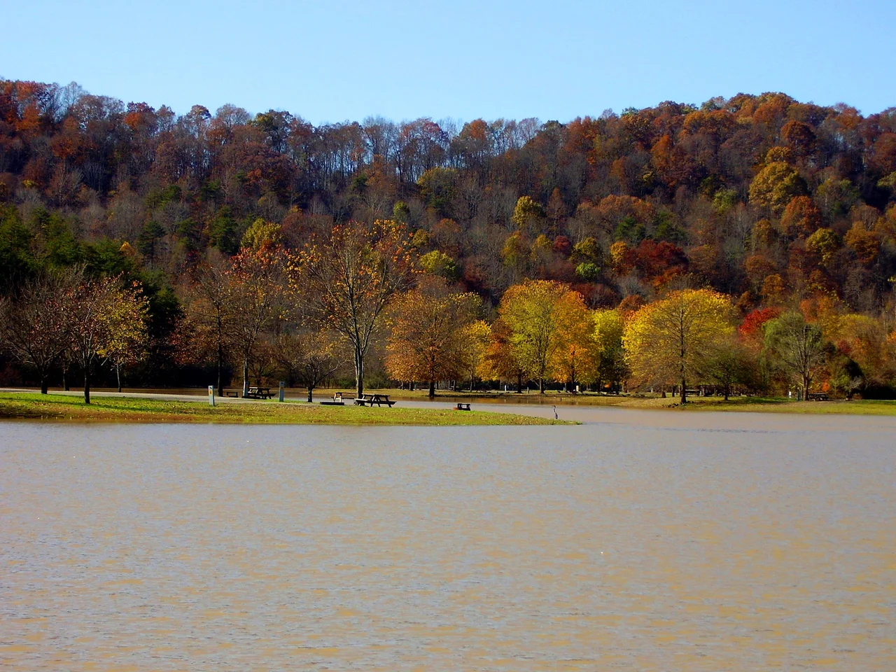 Photo of Beech Fork Lake at Beech Fork State Park in Wayne County, West Virginia, looking west from a road approaching a small automobile bridge.
