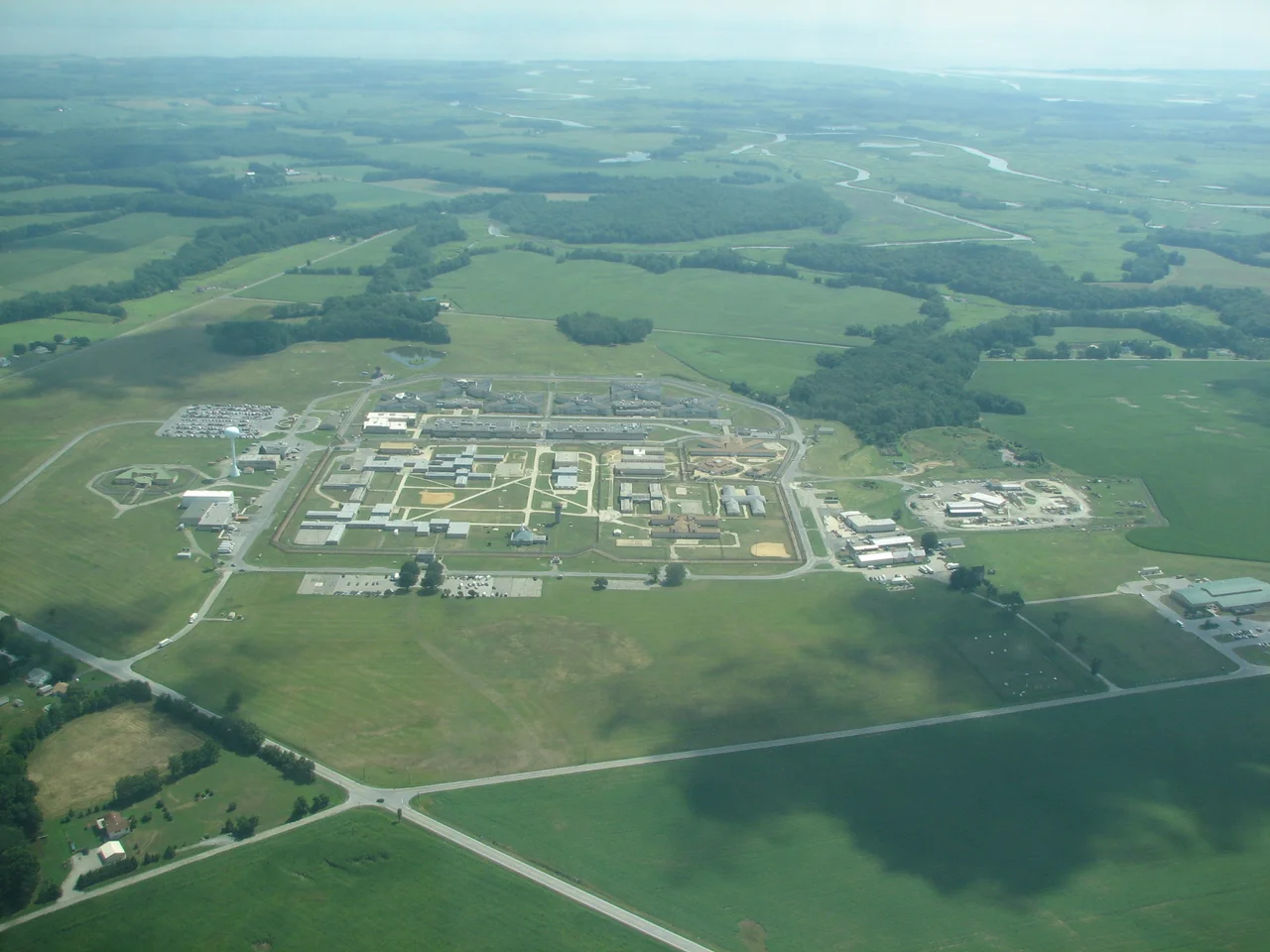 This is now the James T Vaughn Correctional Center (and was Delaware Correctional Center). These things always stand out when flying by. The Delaware River (bay?) is in the background.