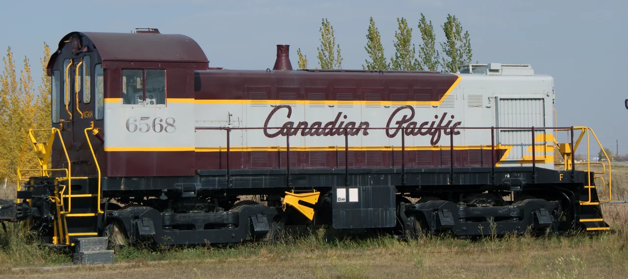 Saskatchewan Railway Museum Canadian Pacific Railway S3 diesel electric locomotive #6568 constructed in 1957 by Montreal Locomotive Works. According to the SRM, it has a 660 horsepower McIntosh and Seymore 539 diesel engine which operates a General Electric generator. The electricity produced is 600 volts direct current which turns four traction motors driving each axle. This locomotive was used in Sutherland CPR train yards. This particular railway locomotive is a light switcher and was used to switch cars between tracks in the Sutherland train yards.