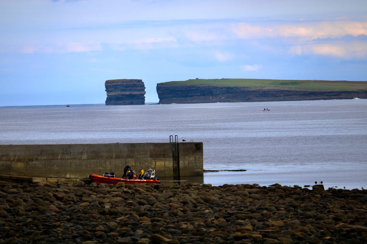 View Bunatrahir Bay with Downpatick Head