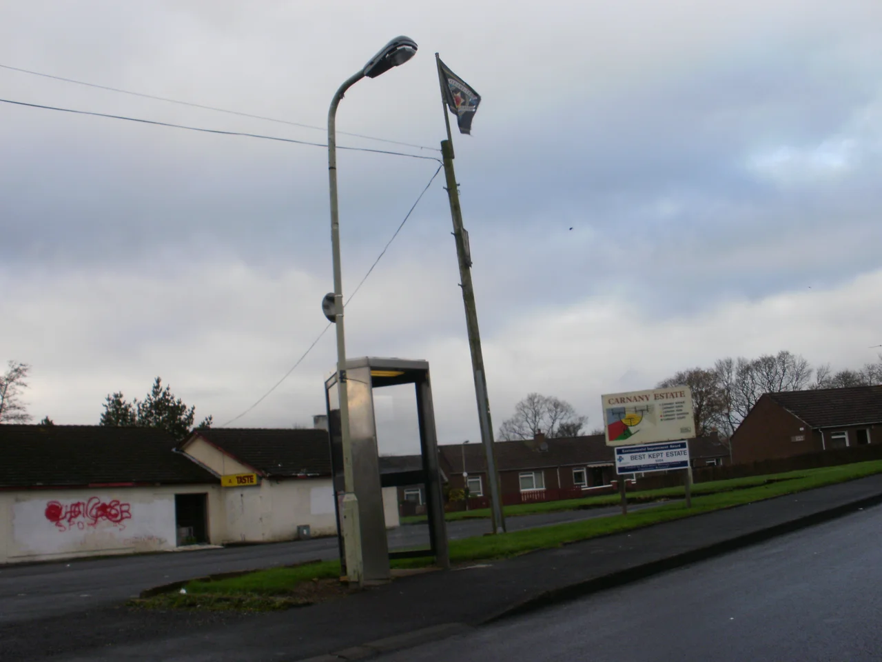 The entance to the Carnay Estate in Ballymoney,County Antrim,Northern Ireland.The flag flying on top of the pole is that of the loyalist paramilitary group the UFF.(Ulster Freedom Fighters)