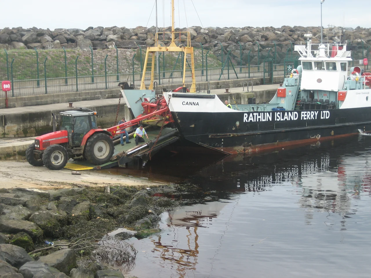 MV Canna, Rathlin Island ferry at Ballycastle, County Antrim, Northern Ireland. Massey Ferguson 6290 tractor with a Taarup (Kverneland) mower