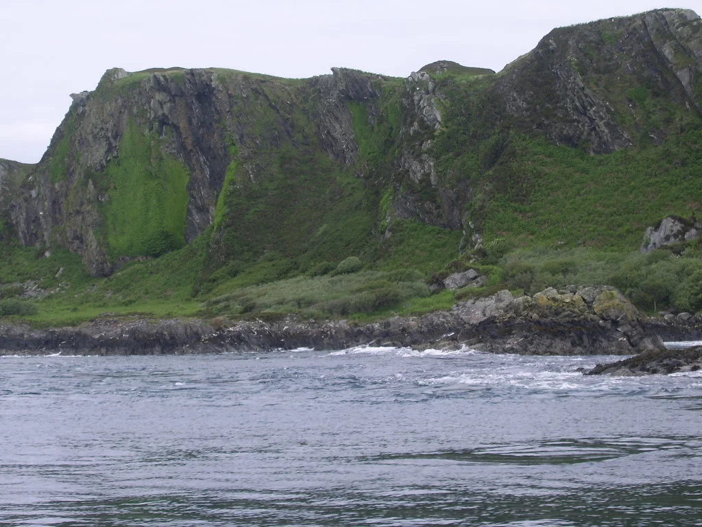 Raised beach cliff line on Lunga, Argyll, Scotland