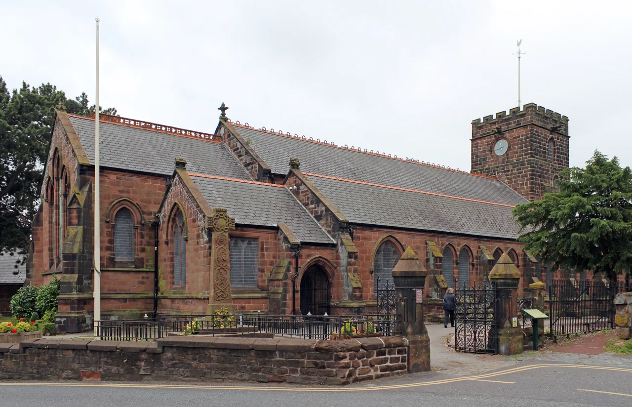 Grade II* listed mostly 17th century church in Neston, Cheshire. View south across High Street.