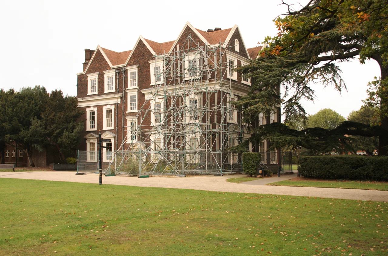 Boston Manor House, south west corner with its long term 'temporary' supporting scaffolding. Currently on the English Heritage at Risk Register. Basic repair work to this building estimated to cost a minimum of £1.3M. Owners pursuing possible future options for use.