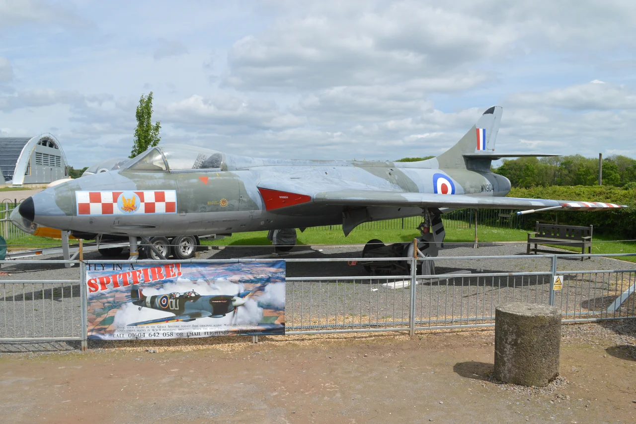 c/n S4/U/2912.
Built 1954.
British military serial WN904.
Among the 1,972 Hunters built, the F.2 was a rare mark. It was powered, along with the F.5, by the 8,300lbf Armstrong Siddeley Sapphire 101, instead of the Rolls-Royce Avon used in all other marks of Hunter.
Built by Armstrong Whitworth at Coventry, only 45 were produced and this is now the only surviving example.
Delivered to 257sqn at Wattisham in September 1954, she remained with the unit until severely damaged in January 1956. Although repaired, she was then stored until 1958 when she went to the Melksham School of Technical Training as ‘7544M’.
In 1974 she was donated to the Imperial War Museum collection at Duxford, but was later loaned out to serve as a gate guard at Waterbeach Barracks, the former RAF Waterbeach.
She is now painted in 56sqn markings and is on permanent display at the Sywell Aviation Museum.
Sywell Aerodrome, Northamptonshire, UK.
21st May 2017