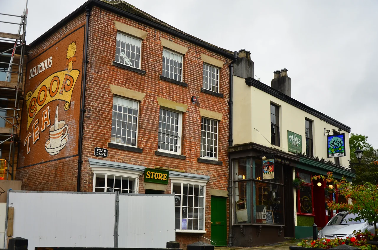 Rochdale Pioneers Museum, 31 Toad Lane, Rochdale. Exterior view, showing the original brick building and the 2012 extension
