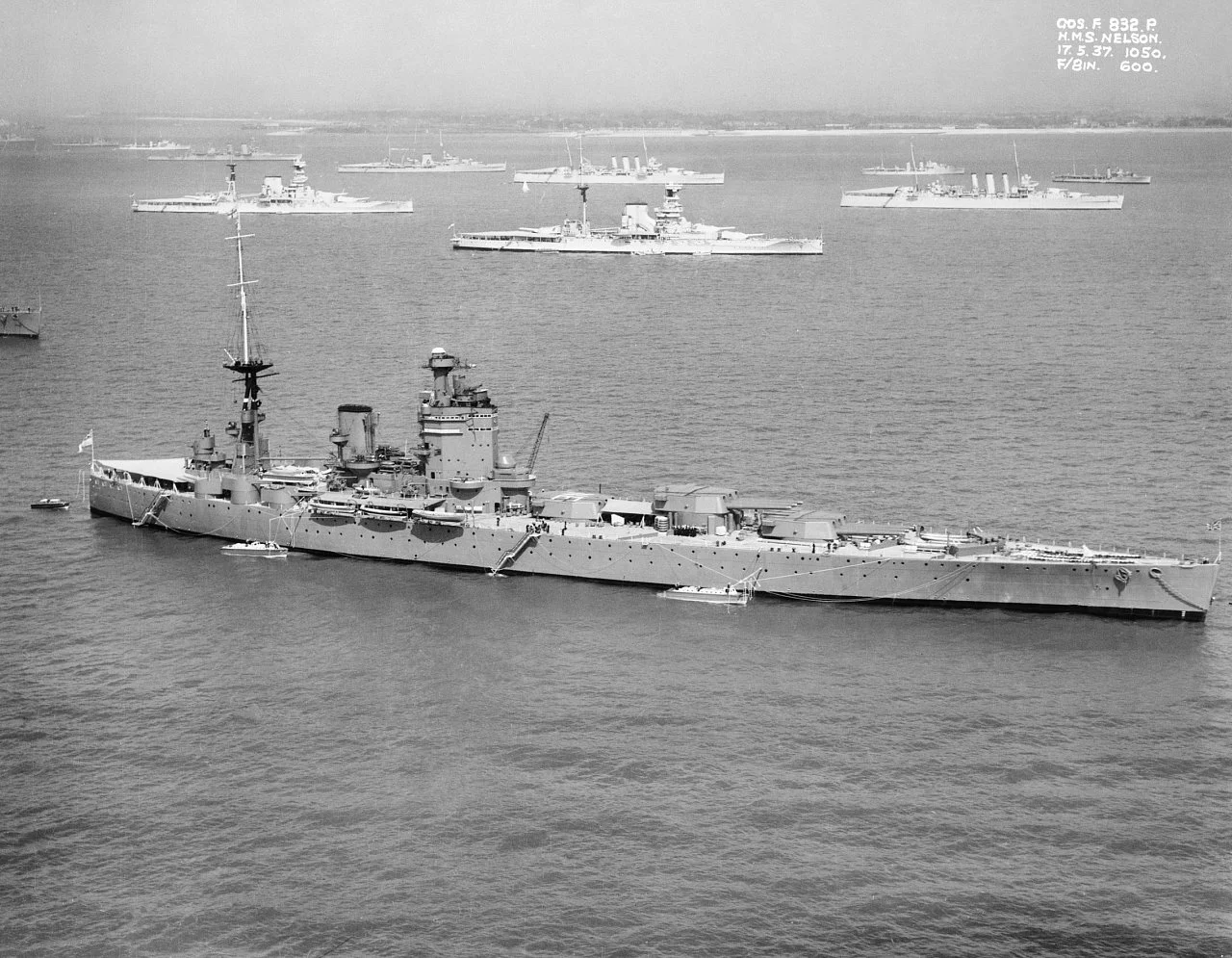 IWM caption : The British battleship HMS NELSON off Spithead for the 1937 Fleet Review. Anchored in the background are two Queen Elizabeth Class battleships and two cruisers of the London Class.