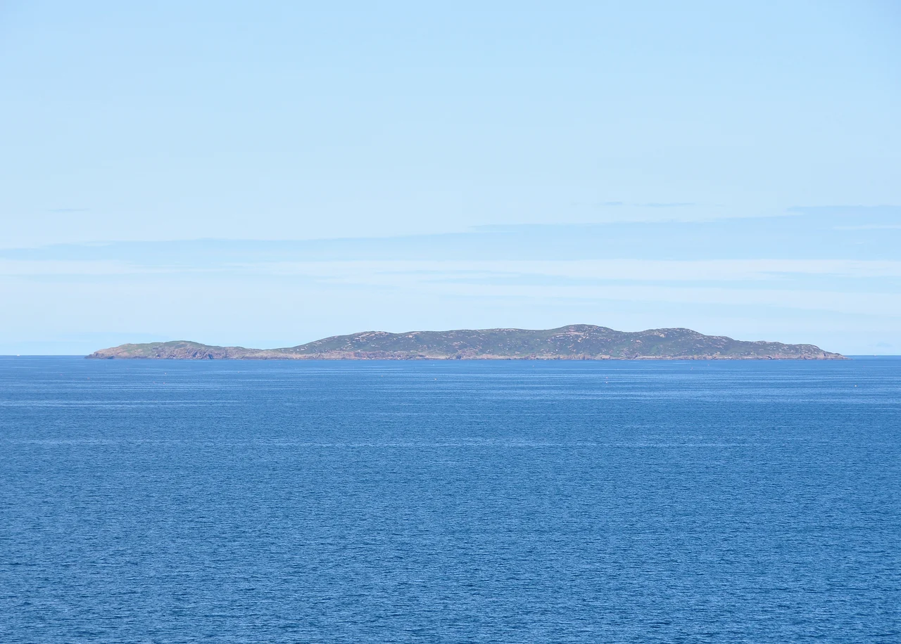 Priest Island, the westernmost of the Summer Isles of the coast of northwest Scotland, seen from the shore of Gruinard Bay