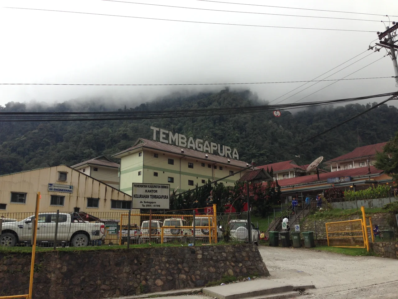 Tembagapura, Papua, Indonesia. The company town for PT Freeport's copper/gold mine. Pictured, the building on the extreme left is a Freeport engineering office, the buildings in the middle and on the right are accommodations blocks. Taken around 1:30 pm, thick clouds are visible at the tops of the mountains, this is typical for this time of day.