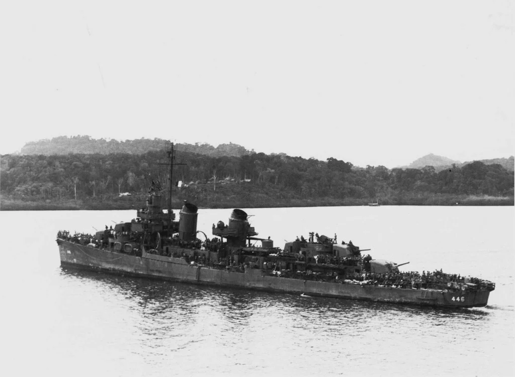 The U.S. Navy destroyer USS Radford (DD-446) steaming into Tulagi Harbour in the Solomons with a deckload of survivors of the sunken light cruiser USS Helena (CL-50), and with the wounded filling all available space below, 6 July 1943. Helena was sunk during the Battle of Kula Gulf the night before. Radford received Presidential Unit Citation for the rescue of 468 survivors.