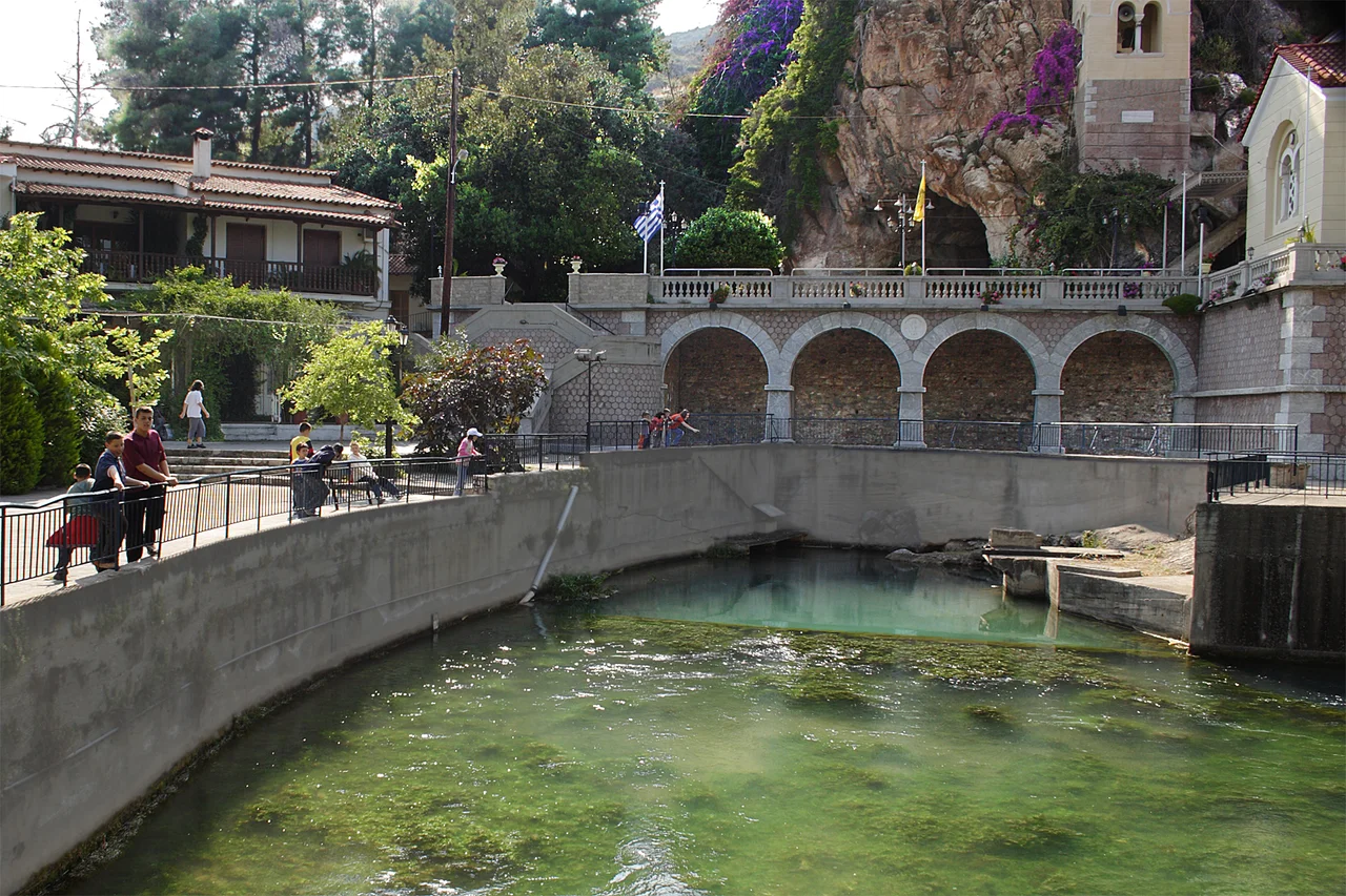 karst spring Kefalari (Argolis, 10 km to the coast and the town Argos). The spring discharge is big, but varies seasonally. According to hydrogeological studies (<1984) the subsurface waterways have two origins: Depression Lake Stymphalia and valley like depression of the regional unit Skoteini-Alea (see Alea, Argolis). The subsurface waterways are fed by old katavothren (καταβόθρα, Greek term for ponor), which drain the depressions, when flooded. This was confirmed by dye tracing. Also see the photo: Image:Alea Argolidas.JPG.
Even in ancient time of Greece this spring was holy. People in those days suspected, that the water comes from Lake Stymphalia, Spring, cave (60 m, geologically a former waterway), the modern orthodox pilgrimage “Zoodochos Pigi” and the church “Panagia Kefalariotissa” form todays sight.