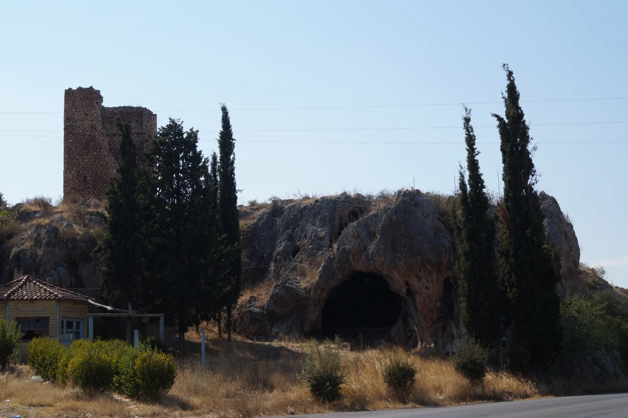 Aliartos, Greece: Cave and medieval tower east of the city.