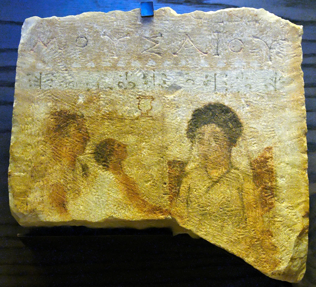 Family scene with inscription “[daughter of] Mousaios”, funerary stele.