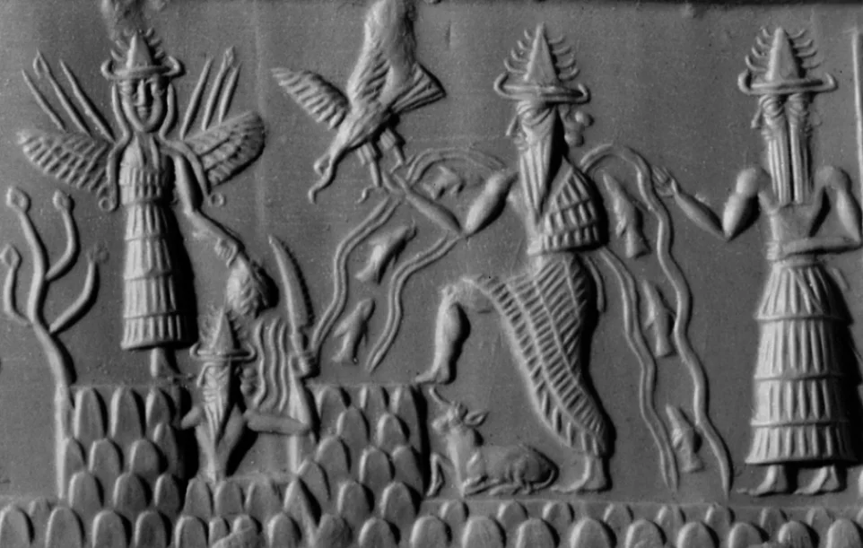Detail of The Adda Seal. The figures can be identified as gods by their pointed hats with multiple horns. The figure with streams of water and fish flowing from his shoulders is Ea (Sumerian Enki), god of subterranean waters and of wisdom. Behind him stands Usimu, his two-faced vizier (chief minister).
At the centre of the scene is the sun-god, Shamash (Sumerian Utu), with rays rising from his shoulders. He is cutting his way through the mountains in order to rise at dawn.
To his left is a winged goddess, Ishtar (Sumerian Inanna). The weapons rising from her shoulders symbolise her warlike characteristics.