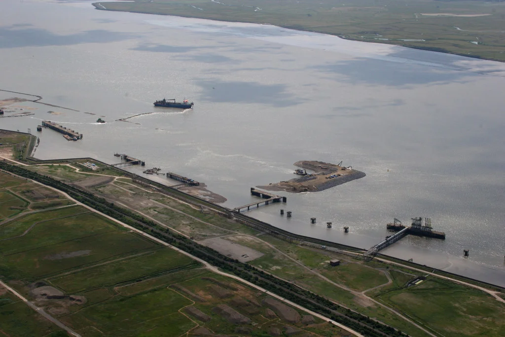 London Gateway Port, Thurrock, Great Britain.
This photo shows part of the construction of the new 'London Gateway' port at Shell Haven.
The existing jetties were from the now demolished Shell Haven Refinery.
Sand is being pumped from the bottom of the Thames to create the new waterfront.