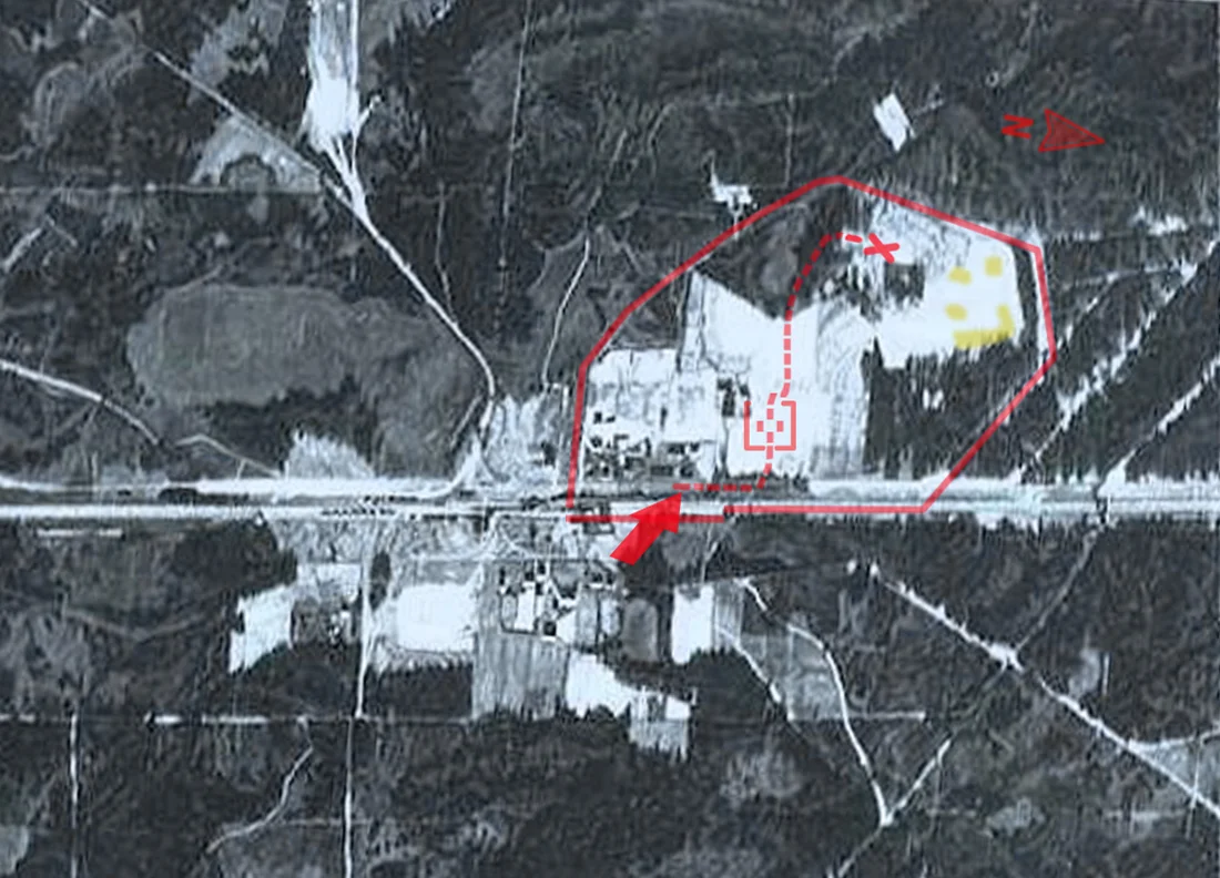 Sobibor extermination camp of the Operation Reinhard in occupied Poland during World War II. Aerial photograph of the camp perimeter. Date unknown, possibly earlier (common with aerial searches for the death factories' most suitable locations). Known camp structures are not there yet, including Camp II barracks (lower centre) built for goods stolen from Holocaust victims, as well as Camp III (Jewish Sonderkommando compound, upper right), and Camp IV (for slave labor, right) abandoned after the Sobibor revolt of 1943. The railway unloading platform (with visible prewar train station) marked with the red arrow, location of gas chambers marked with a cross. Undressing area marked with square with adjacent "Road to Heaven" through the forest marked by a dashed line. Source of the overlaid data: B. Rutherford, 2000, and the Sobibor Museum.
