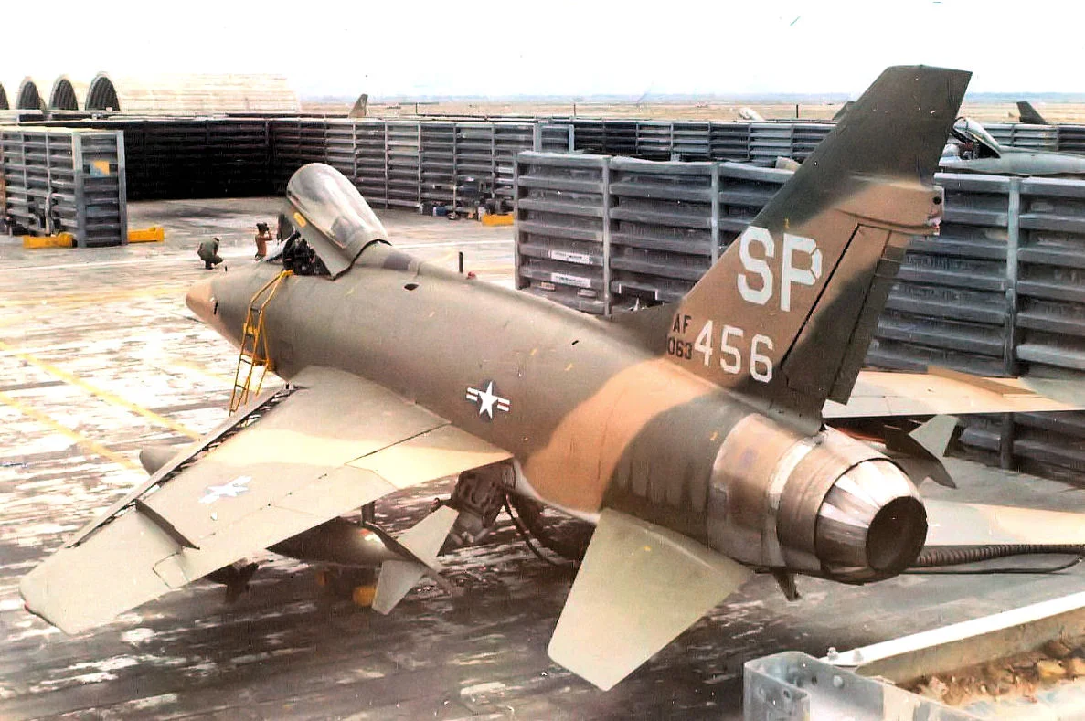 This photo is actually the property of me, Sgt John Panas, Jr (retired MSgt), the crewchief of Acft 56-3456. I crewed her from 1969 to 1970. Named "Darlene's Dear" by my pilot, Lt Col Reagon. I climbed the revetment wall to get this angle for the picture. It was a favorite technique used by many of the crewchiefs at the time.