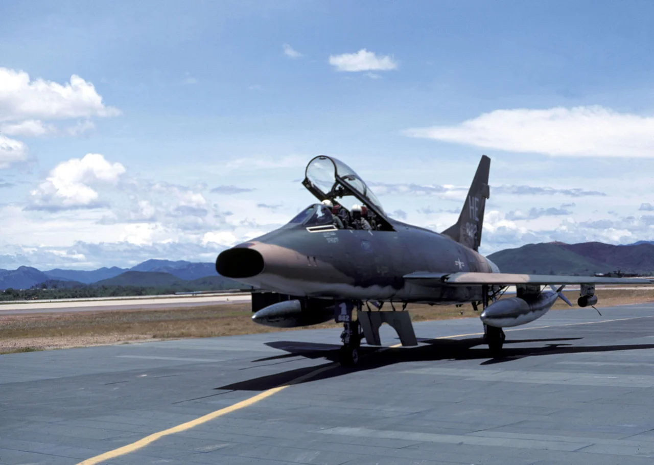 A U.S. Air Force North American F-100F-10-NA Super Sabre aircraft (s/n 56-3882) of the 416th Tactical Fighter Squadron, 37th Tactical Fighter Wing at Phu Cat air base, South Vietnam. The 416th TFS operated from Phu Cat with F-100s from 15 April 1967 to 27 May 1969. The F-100Fs were used in the forward air controller role. The F-100F 56-3882 was finally retired to the MASDC on 7 September 1979 as FE0591.