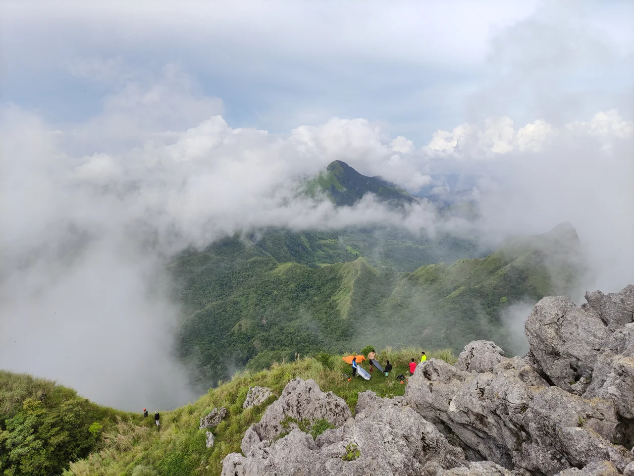 Scenic mountain view at the summit of Iloilo Pride mountain "Mt. Napulak".
Mt. Napulak is one of Igbaras’ most sought after tourist attractions. Standing 1,239 meters tall, the mountain surely is a challenge to climb but the challenge is all worth it as soon as you realize that the journey is just as beautiful as the destination.
Mt. Napulak. Meaning “nipple” in the local language because of the rounded rock that sits at its very summit, this mountain is the most popular hiking destination in Panay, given its easy access from the university town of Miag-ao and the major commercial centre in the region, Iloilo City, where many local mountaineers are based.