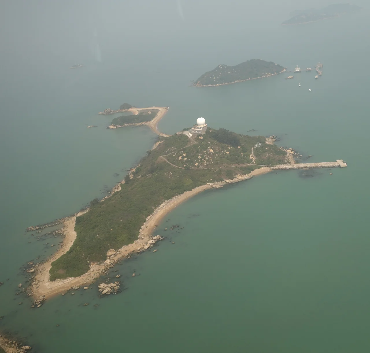 Aerial Overview of Sha Chau as seen from Southwest, Pak Chau is faintly visible to the Northwest, Lung Kwu Chau to the Northeast in the background.