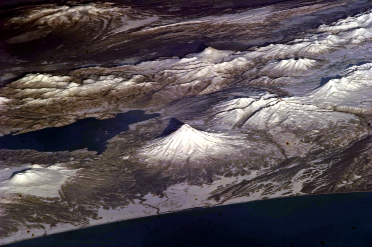 View of Petropavlovsk-Kamchatsky's harbour from Avacha Bay, with Mount Koryaksky rising in the background.
